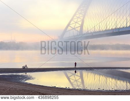 Novosibirsk Region, Siberia, Russia - 08.30.2020: Fisherman Have Bugrinskij Bridge In The Morning Mi