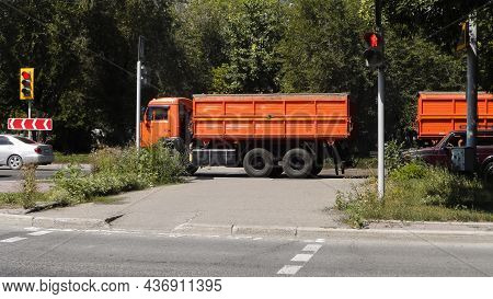 Big Orange Truck On The Road. Russian Truck.