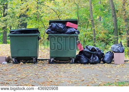 Dumpsters Being Full With Garbage In The Park. Garbage Waste Lots Junk Dump. Pin Ollution From Waste