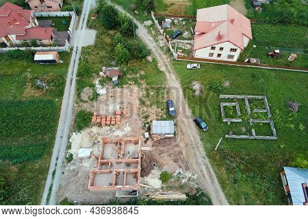 Top Down Aerial View Of Building Works Of New House Concrete Foundation On Construction Site.