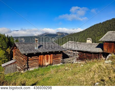 Idyllic Mountain Landscape In The Alps Above Monstein, Davos. Beautiful Wooden Houses, Chalets With 