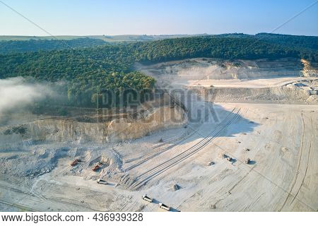 Aerial View Of Open Pit Mining Site Of Limestone Materials Extraction For Construction Industry With