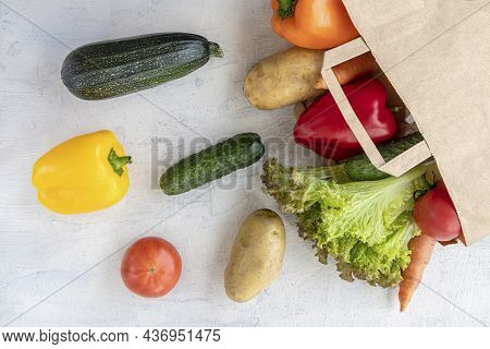 Eco Concept For Shopping, Food Preparation. Top View On Paper Bag With Carrots, Cucumbers, Bell Pepp