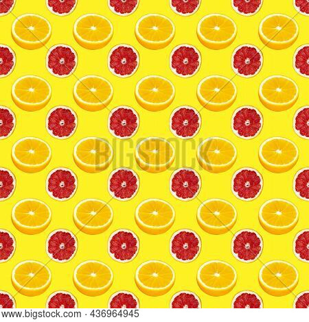 Fresh Orange And Grapefruit Slices Seamless Pattern Over Yellow Background, Top View