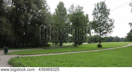 Public Park In The City Without People In Winter With Trees And Plants