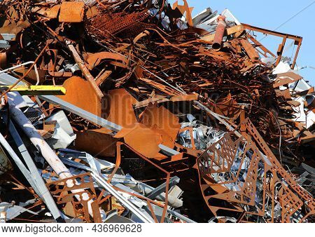 Pile Of Rusty Pieces Of Iron In The Recycling Shop For The Recovery Of Metal Material For Recycling
