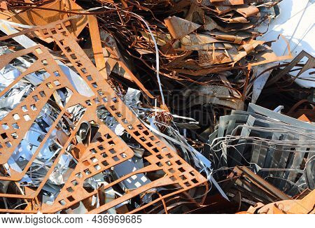 Pile Of Many Rusted Ferrous Scrap In A Landfill Controlled By A Foundry