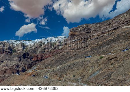 View From Athinios Port To Fira, The Capital Of Santorini Island And Multi-colored Volcanic Cliffs, 