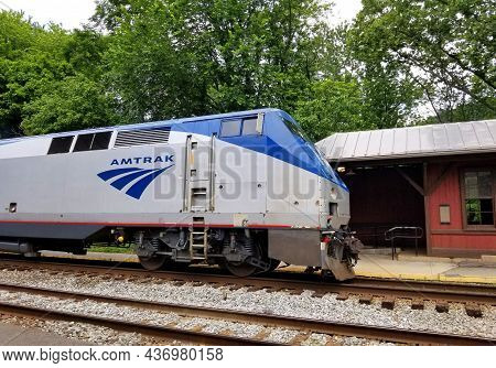 Harpers Ferry, Virginia, U.s.a - June 19, 2021- An Amtrak Train Stopped By The Railway Station