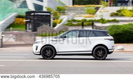 Moscow, Russia - August 2021: White Range Rover Evoque Second Generation L551 Driving On A City Road
