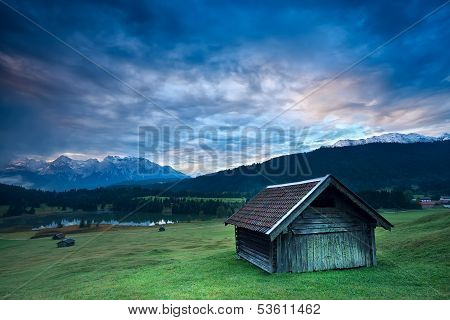 Wooden Hut By Geroldsee Lake During Sunrise