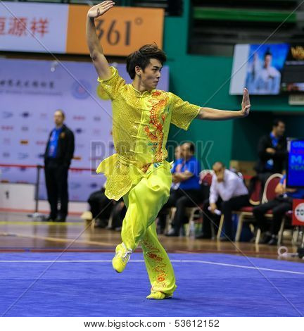 KUALA LUMPUR - NOV 03: Yeap Wai Kin of Malaysia shows his fighting style in the 'changquan compulsory' event at the 12th World Wushu Championship on November 03, 2013 in Kuala Lumpur, Malaysia.