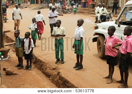 African Children Attentively Look At Someone.