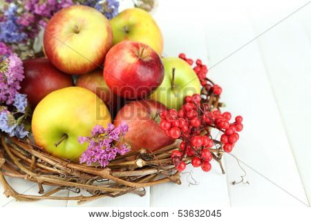 Juicy apples on white wooden table