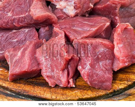 Cut Raw Meat On Cutting Board Close Up