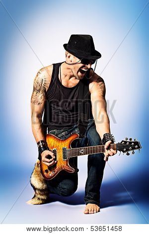 Rock musician is playing electrical guitar.