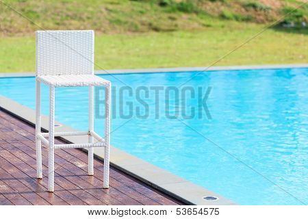 White Chiar Beside The Swimming Pool