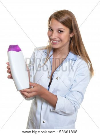 Beautiful laughing female seller presents new lotion