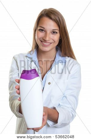 Beautiful laughing female seller presents new lotion