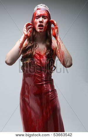 Horror Image of a Woman Dripping in Blood Wearing Prom Dress