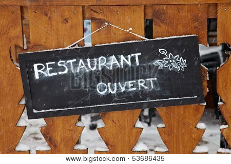 Sign at the entrance of a restaurant
