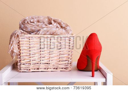 Red women shoes and scarf in room