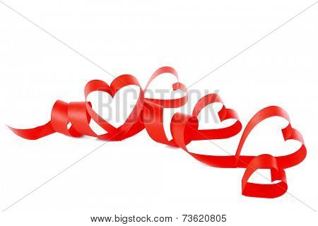 Heart shaped red paper ribbon isolated on white