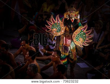 BALI, INDONESIA - SEPTEMBER 19, 2014: Characters from the Hindu mythology Ramayana appear in a staged presentation of the traditional Balinese Kecak Fire Dance held at the Uluwatu Temple in Bali.