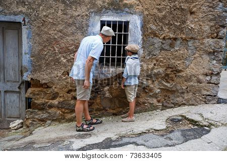 Father and his son in village Orgosolo, Italy