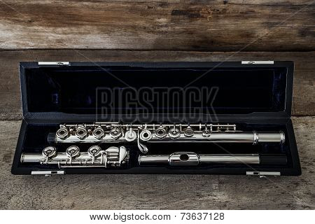 Modern Concert Flute On A Wood Table
