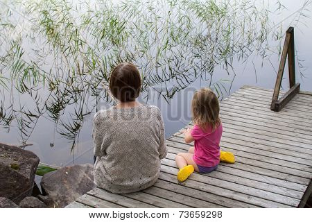 Grandmother and child at pier