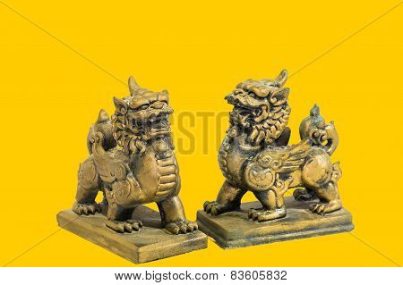 Chinese talisman figurine yellow background