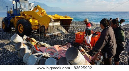 Fishermen Unload The Fishes From The Boat By Using Truck In Hualien, Taiwan