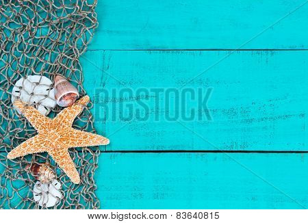 Starfish and shells in fish netting on teal blue wood sign
