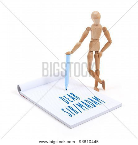 Wooden Mannequin Writing In Scrapbook - Dear Sir Madam