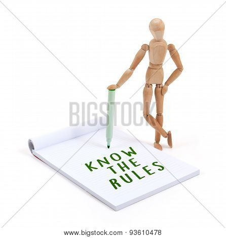 Wooden Mannequin Writing In Scrapbook - Know The Rules