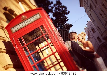 Bride And Groom Near Phonebooth