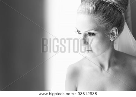 Black And White Portrait Of A Bride Near Window