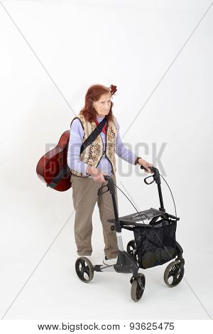 Elderly Lady With Rollator And Musical Instruments.