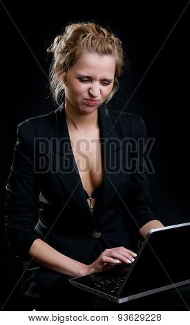 Girl With A Pout Holding A Laptop