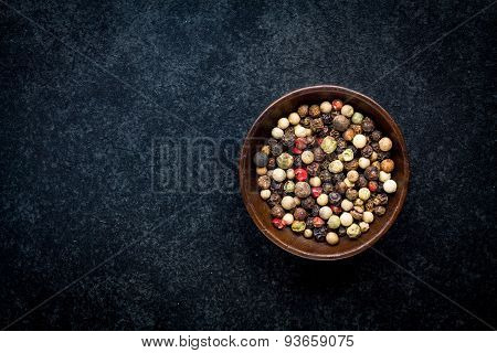 Peppercorns In A Wooden Bowl
