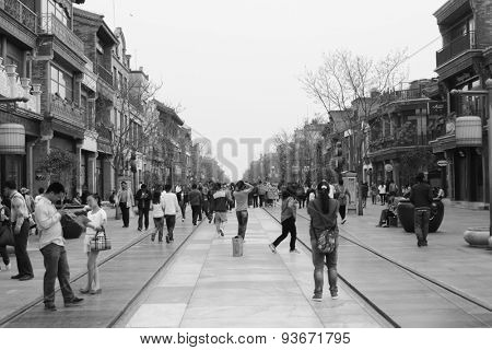 BEIJING - APRIL 27: Tourists and shoppers line Qianmen Street on April 27, 2013 in Beijing, China. Qianmen Street is a famous tourists place in Beijing