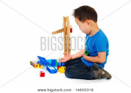 Chinese Boy Playing With Toys