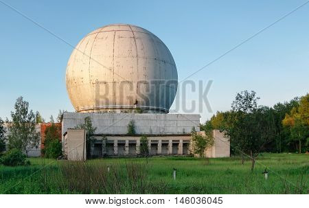 Old giant dome of a radar antenna of a Russian military base