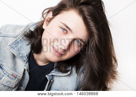 Fashion portrait of a beautiful teenager wearing jeans jacket