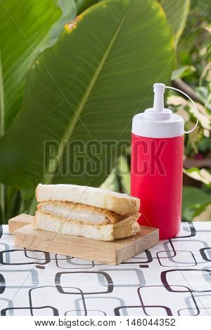 Tongkatsu pork sandwich on the wooden plate