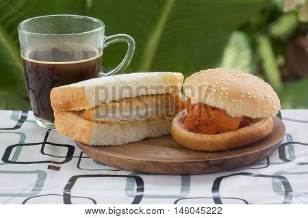 Spicy Chicken Burger tongkatsu sandwich and black coffee