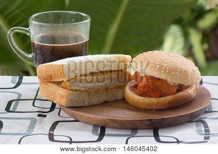 Spicy Chicken Burger tongkatsu sandwich and black coffee