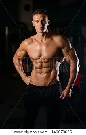 Strong Athletic Man Fitness Model Showing Six Pack Abs