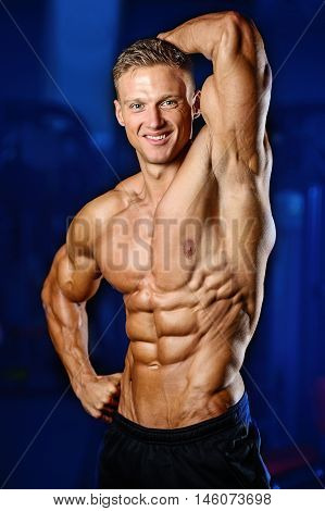 Strong Athletic Man Fitness Model Showing Six Pack Abs